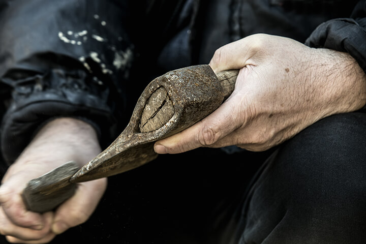 sharpening a rusty ax