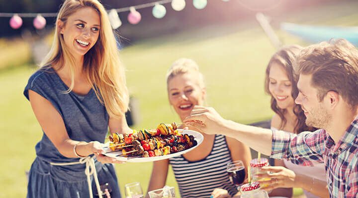 hostess serving food outdoors