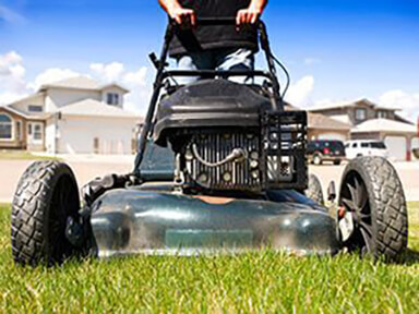 View looking up from the ground towards a lawn mower