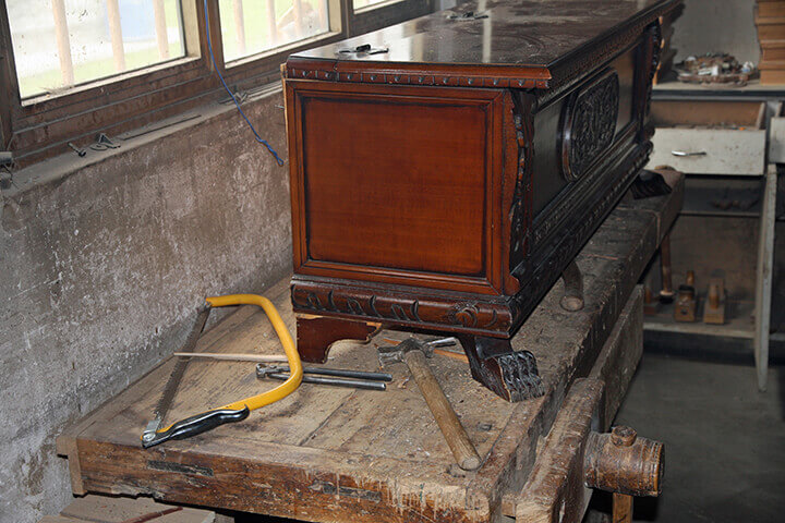 antique dresser in a work room
