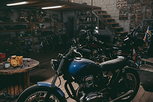 cluttered and warm motorcycle garage scene