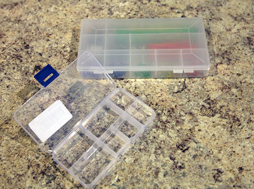 Use the plastic trays that come with removable tabs. This will allow you to use them for many different sized parts.
