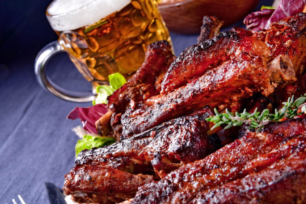 Ribs and beer on table