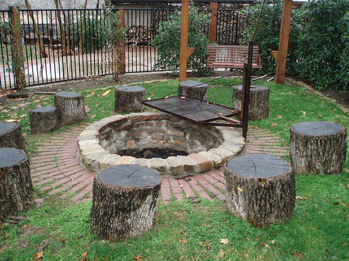 stumps as chairs around a fire pit