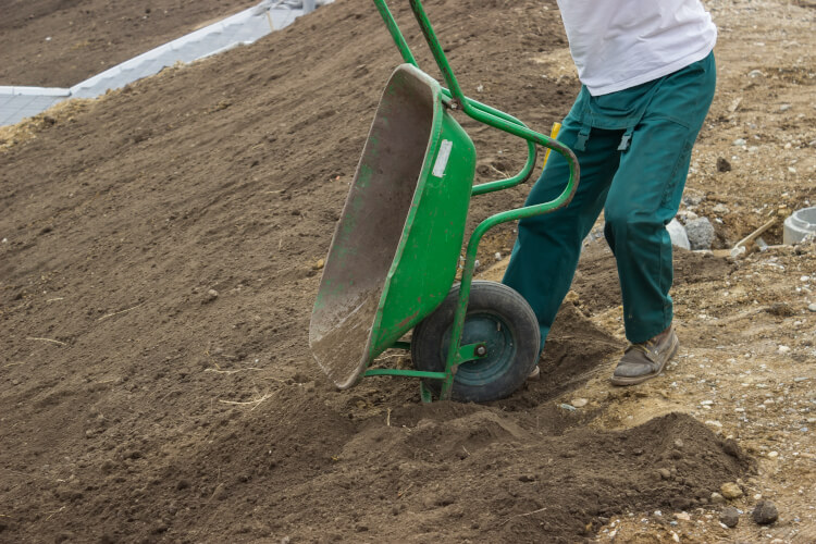 emptying wheelbarrow